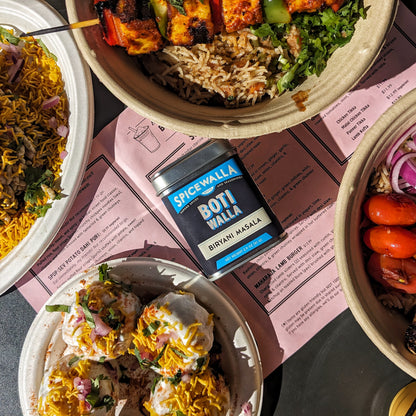Spicewalla Botiwalla bIRYANI masala spice tin on table with Botiwalla dishes 
