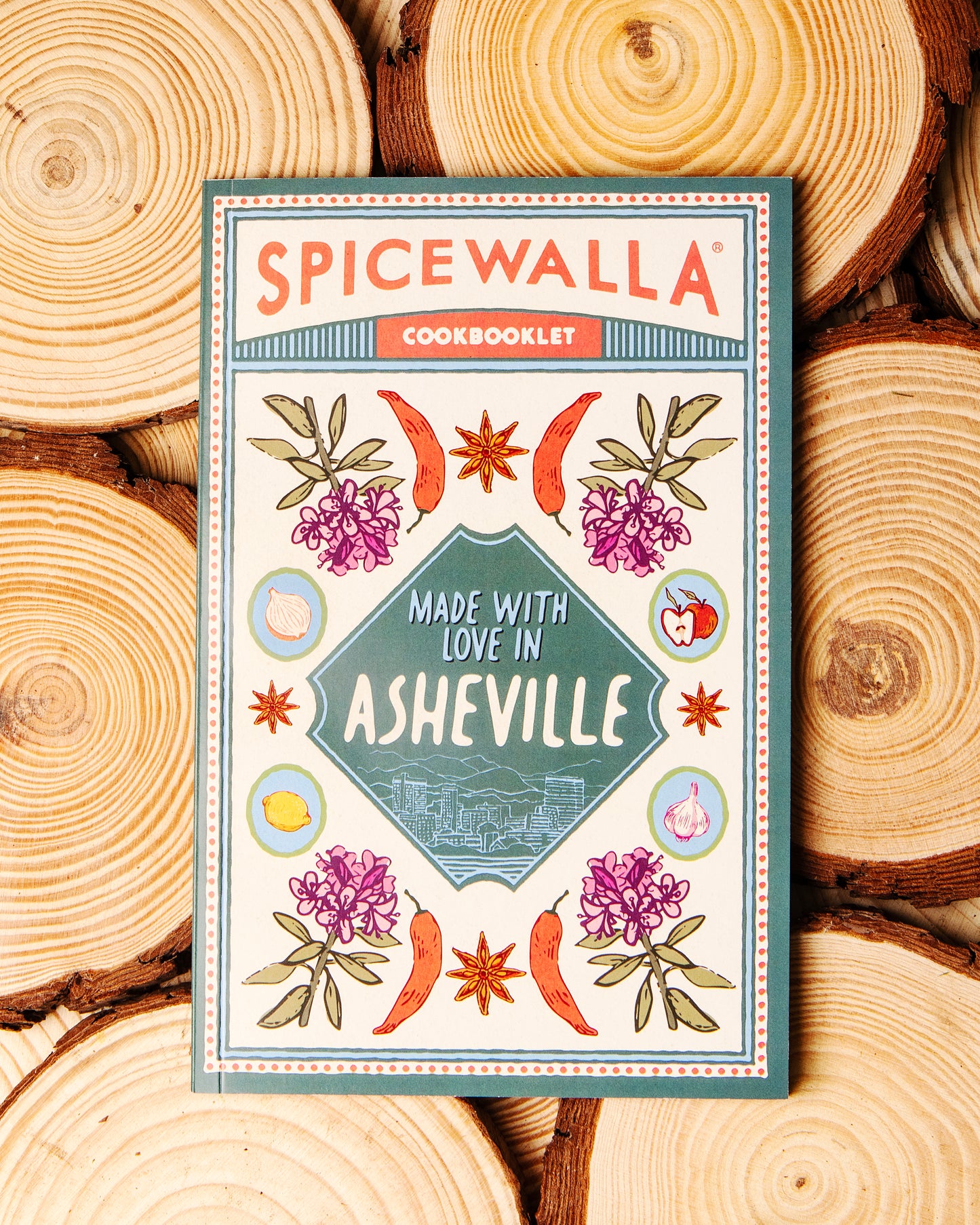 Spicewalla cookbooklet on a wooden background
