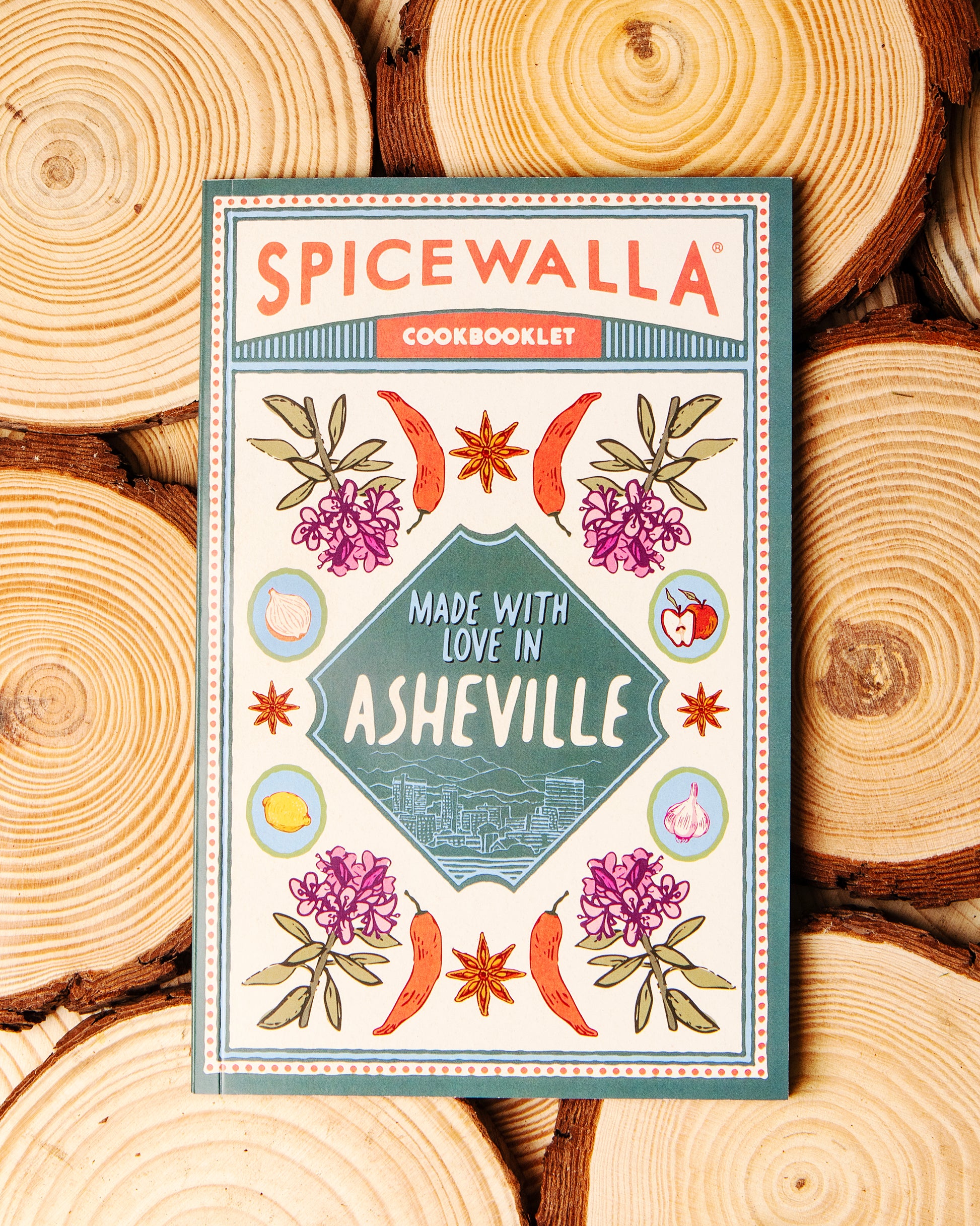 Spicewalla cookbooklet on a wooden background