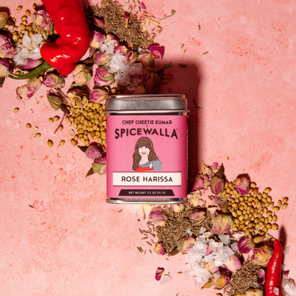 Spicewalla Rose Harissa with ingredients on a pink background