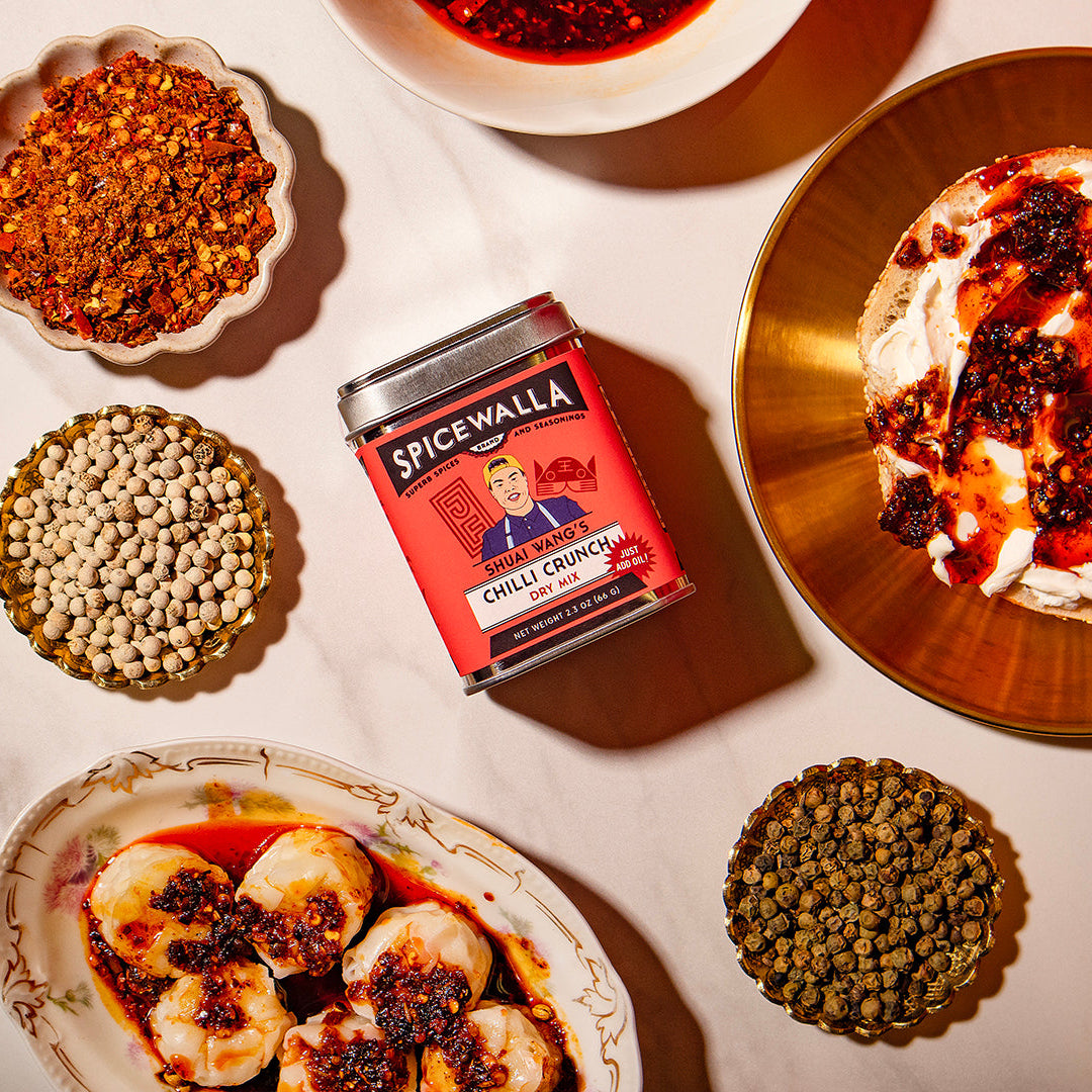 Spicewalla chili crumbles can with various chili ingredients on a white surface