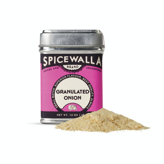 Spicewalla granulated onion seasoning can with a small pile of onion powder on a white background