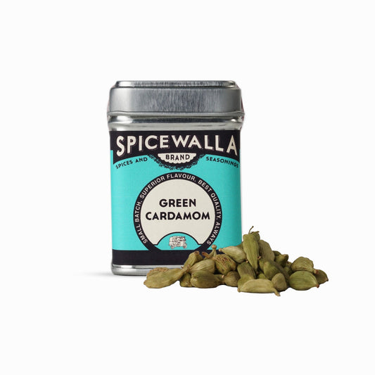 Spicewalla green cardamom canister with cardamom pods on a white background